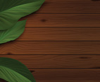 Wooden Background with Green Leaves